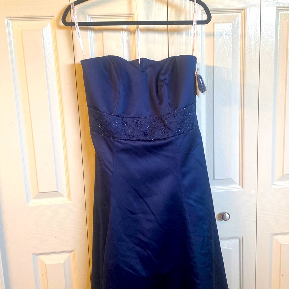 Marine blue size 12 strapless David’s Bridal dress. Never worn. Tags still on.